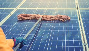 cleaning solar panels with squeegee mop