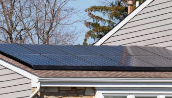 gutters and solar panels on home